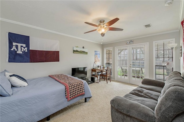 carpeted bedroom featuring access to exterior, ornamental molding, french doors, and ceiling fan