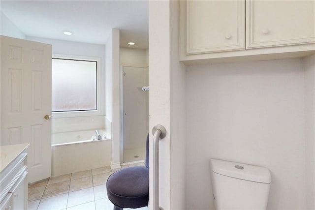 3900 Puffin Way, College Station, TX 77845 - bathroom with vanity, a bath, tile patterned floors, a stall shower, and toilet