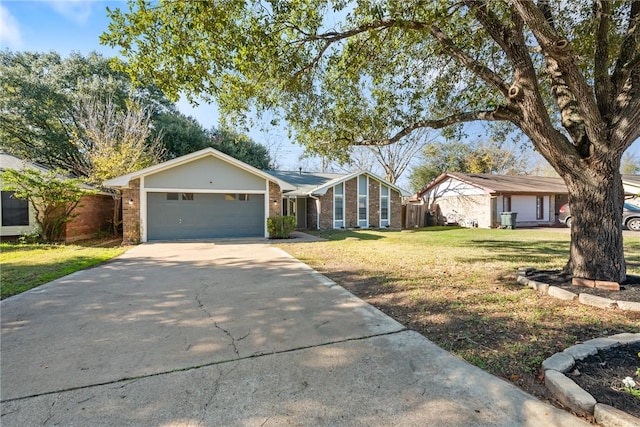 ranch-style home featuring a front yard and a garage