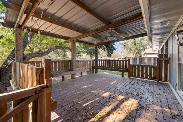 wooden deck featuring ceiling fan