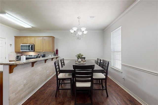 130 Forest Dr, College Station, TX 77840 - dining area featuring plenty of natural light, dark wood finished floors, a chandelier, and ornamental molding
