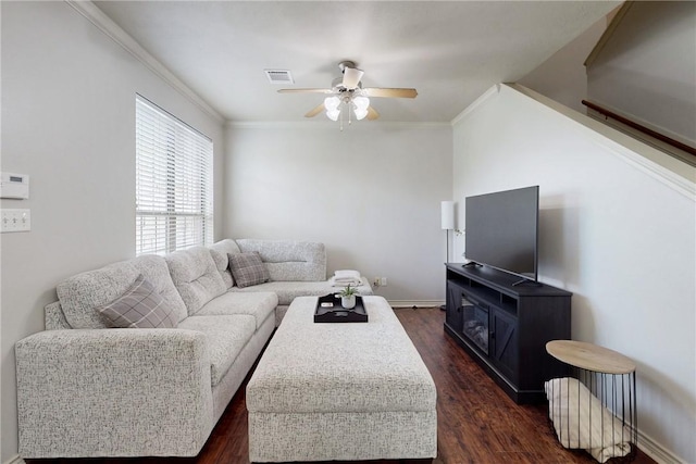 130 Forest Dr, College Station, TX 77840 - living area featuring ceiling fan, dark wood-style flooring, ornamental molding, and baseboards