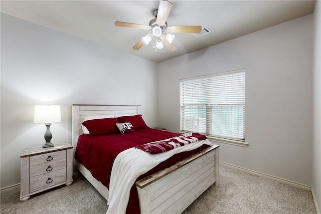 130 Forest Dr, College Station, TX 77840 - bedroom with light carpet, baseboards, and a ceiling fan