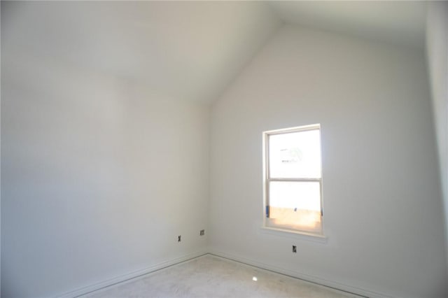 2581 Dove Xing, Navasota, TX 77868 - unfurnished room featuring lofted ceiling and concrete flooring