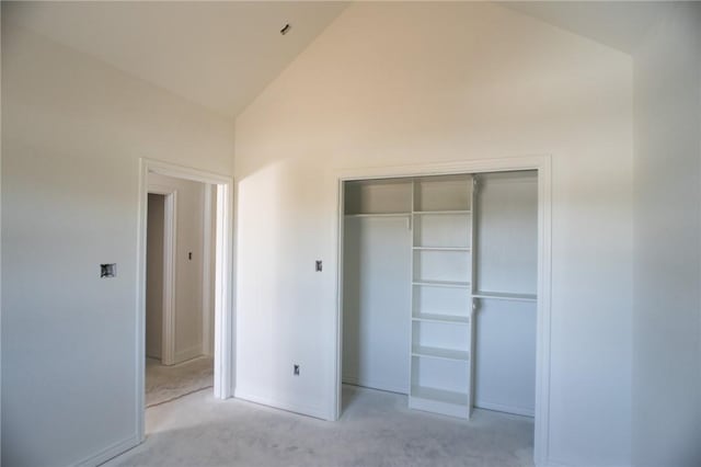 2581 Dove Xing, Navasota, TX 77868 - unfurnished bedroom with carpet, high vaulted ceiling, a closet, and baseboards