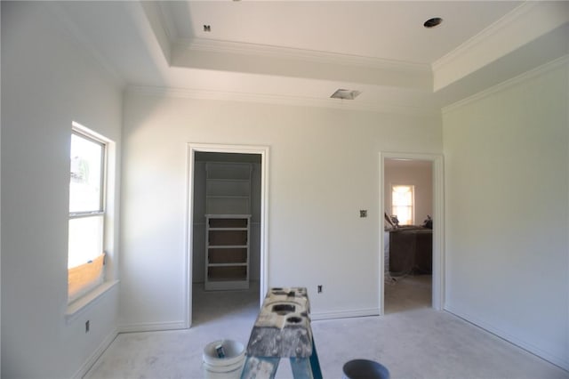 2581 Dove Xing, Navasota, TX 77868 - interior space featuring a closet, a tray ceiling, a walk in closet, and ornamental molding