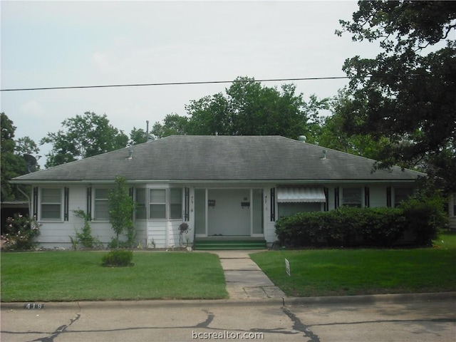 ranch-style home featuring a front yard