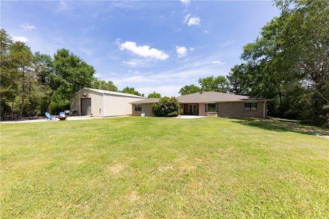 2025 Carter Lake Dr, College Station, TX 77845 - view of yard featuring an outdoor structure and a garage