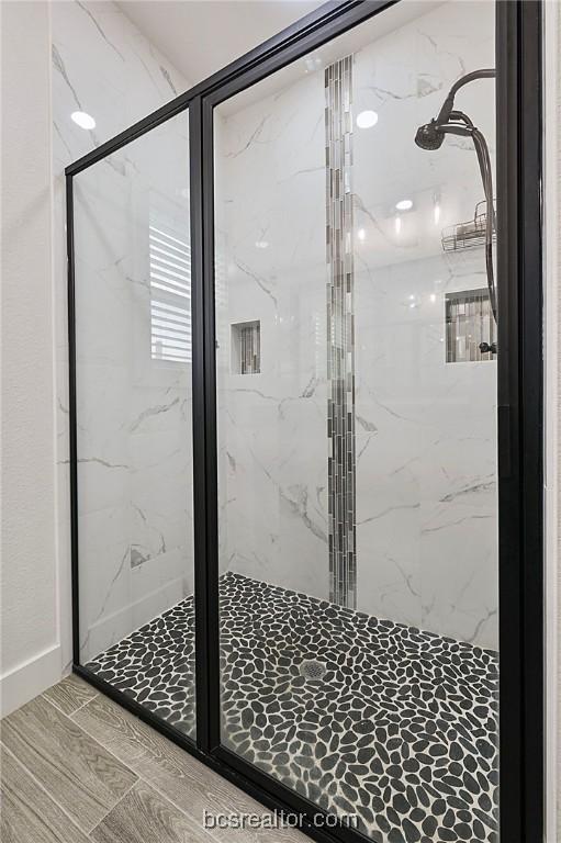 bathroom featuring an enclosed shower