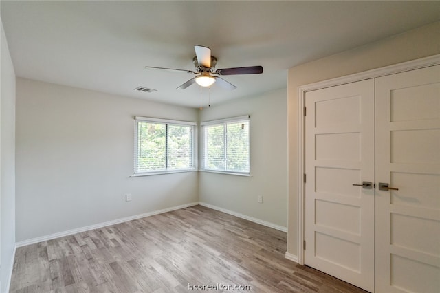 unfurnished bedroom featuring a closet, ceiling fan, and light hardwood / wood-style floors