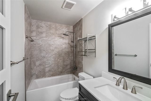 full bathroom featuring vanity, toilet, and tiled shower / bath combo