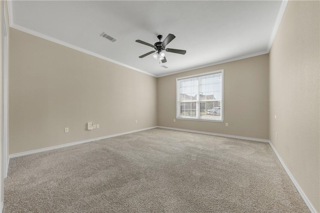 spare room with light carpet, ceiling fan, and crown molding