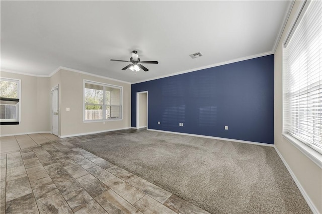 spare room with ceiling fan, carpet floors, and ornamental molding