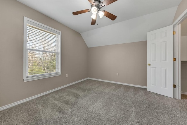 additional living space with ceiling fan, carpet floors, and vaulted ceiling