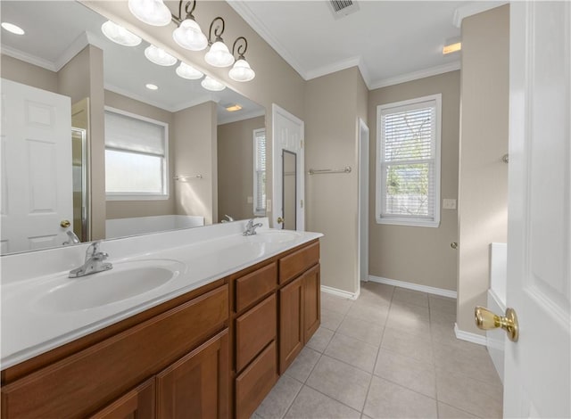 bathroom featuring tile patterned floors, vanity, a shower with shower door, and ornamental molding