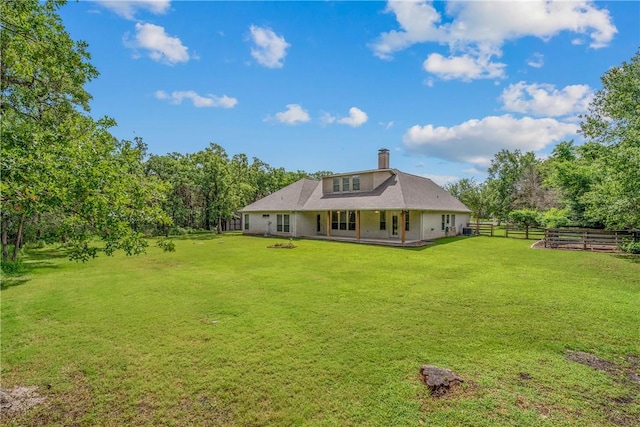 4662 Hidden Springs Way, College Station, TX 77845 - back of house with a chimney