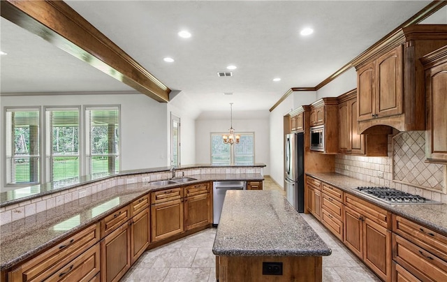 4662 Hidden Springs Way, College Station, TX 77845 - kitchen featuring stainless steel appliances, a sink, a kitchen island, recessed lighting, and healthy amount of natural light