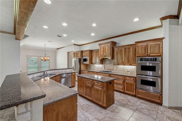 4662 Hidden Springs Way, College Station, TX 77845 - kitchen with stainless steel appliances, a large island with sink, crown molding, tasteful backsplash, and a chandelier