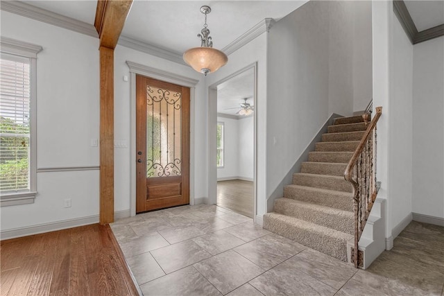 4662 Hidden Springs Way, College Station, TX 77845 - entrance foyer with crown molding, stairway, baseboards, and ceiling fan