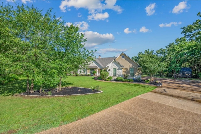 4662 Hidden Springs Way, College Station, TX 77845 - view of front facade with stone siding and a front yard