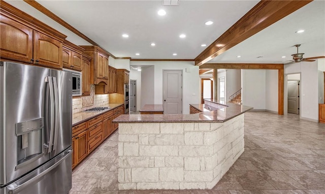 4662 Hidden Springs Way, College Station, TX 77845 - kitchen featuring stainless steel appliances, crown molding, decorative backsplash, stone countertops, and ceiling fan