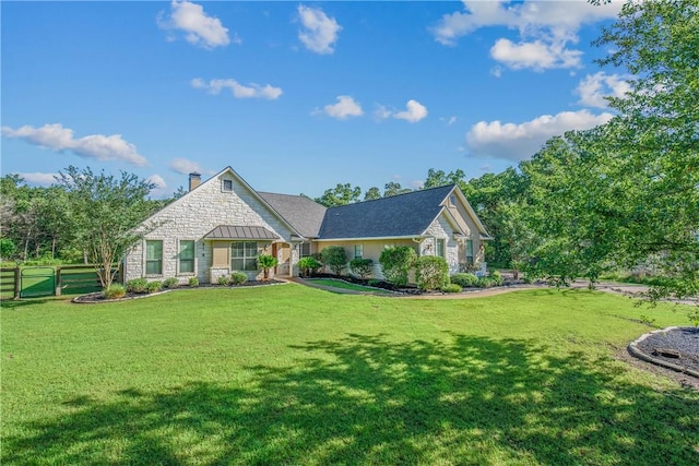 4662 Hidden Springs Way, College Station, TX 77845 - view of front of home with stone siding and a chimney