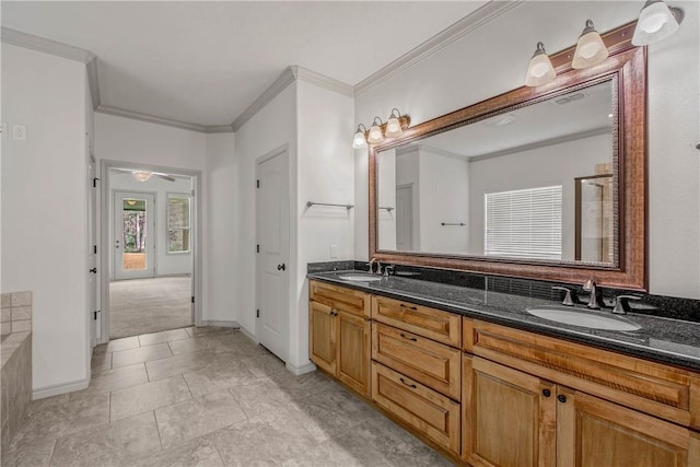 4662 Hidden Springs Way, College Station, TX 77845 - bathroom with double vanity, crown molding, baseboards, and a tub to relax in