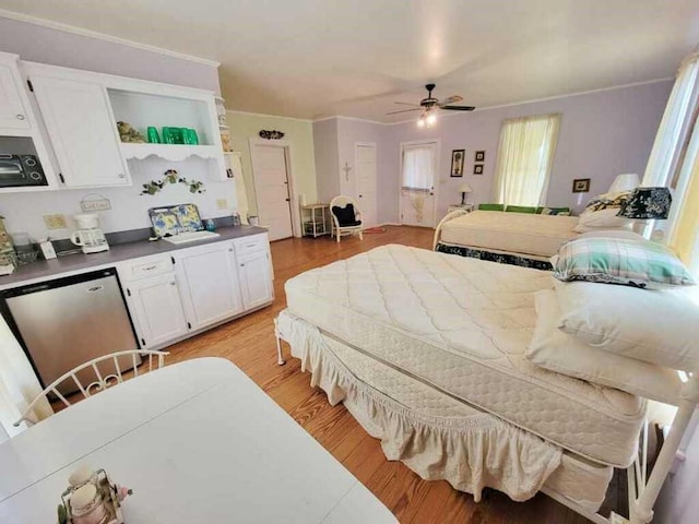 102 S Scott St, Fayetteville, TX 78940 - bedroom featuring light wood-style floors, ornamental molding, and a ceiling fan