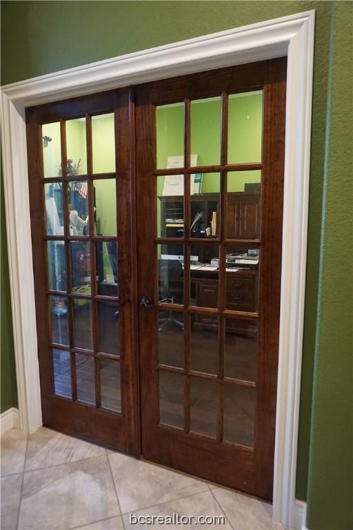 doorway featuring french doors and light tile patterned floors