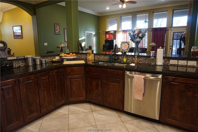 kitchen with ceiling fan, sink, stainless steel dishwasher, light tile patterned floors, and ornamental molding