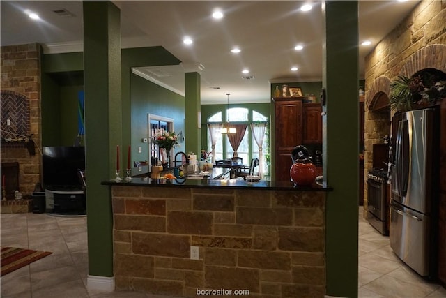 reception featuring a stone fireplace and a notable chandelier