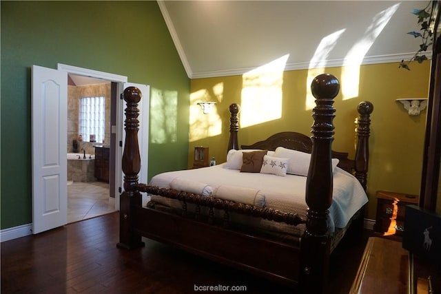 bedroom with vaulted ceiling, connected bathroom, crown molding, and dark hardwood / wood-style floors