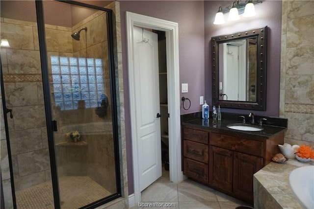 bathroom featuring tile patterned flooring, vanity, and independent shower and bath