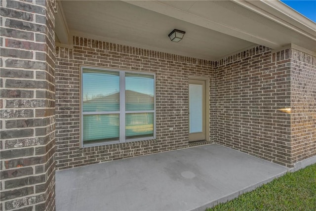 property entrance with a patio