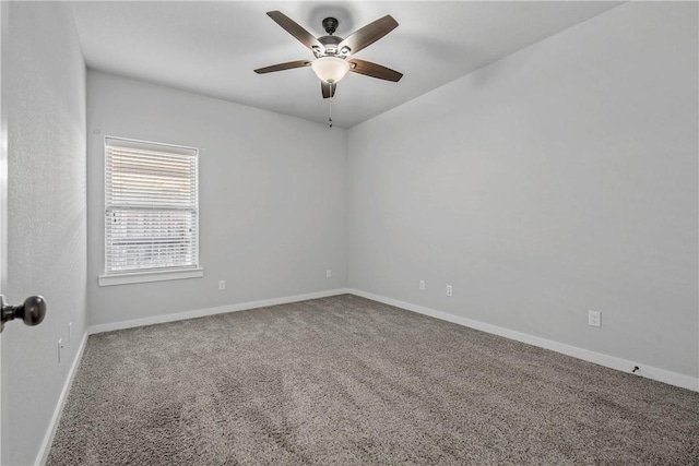 spare room featuring carpet flooring and ceiling fan