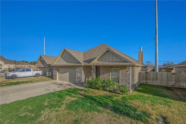 view of front of house featuring a garage and a front yard