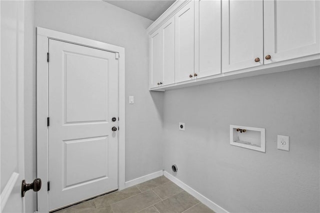 laundry area with electric dryer hookup, light tile patterned floors, cabinets, and washer hookup