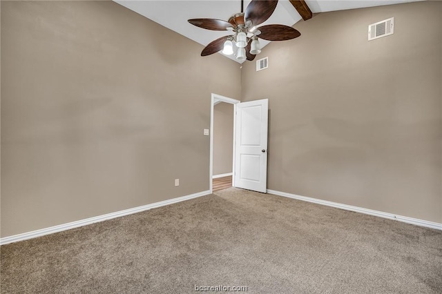 508 N O Neal St, Caldwell, TX 77836 - empty room with carpet flooring, ceiling fan, beam ceiling, and high vaulted ceiling