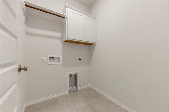 laundry room featuring electric dryer hookup, cabinets, and washer hookup