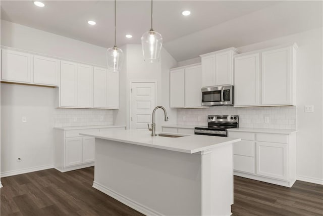 kitchen featuring stainless steel appliances, white cabinetry, and sink