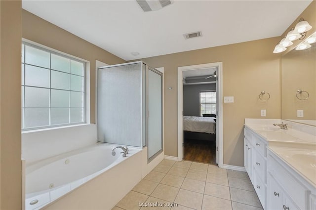 bathroom with tile patterned flooring, vanity, and independent shower and bath