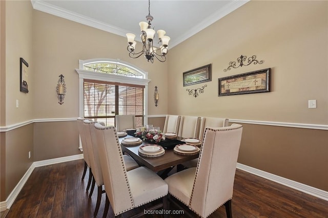 dining area with ornamental molding, dark wood-type flooring, and a chandelier