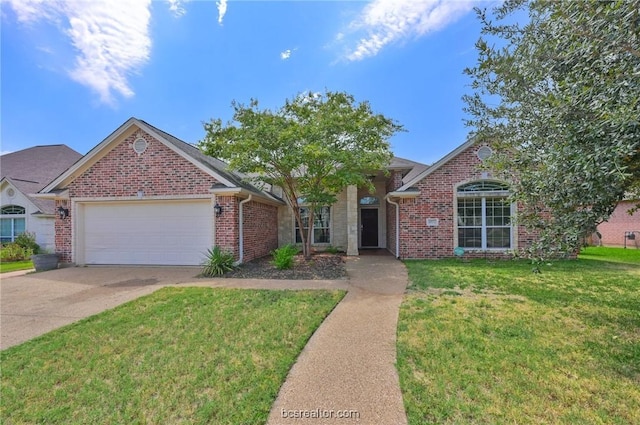 view of front of home featuring a garage and a front lawn