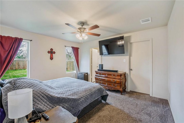 carpeted bedroom featuring ceiling fan