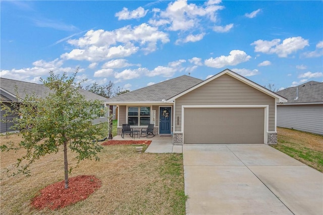 view of front of property with a garage and a front lawn