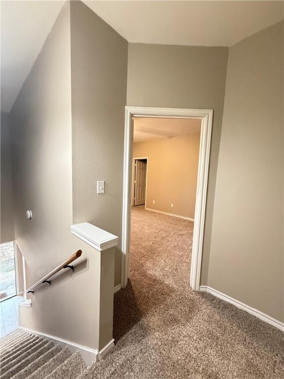 1305 W Villa Maria Rd Unit A-105, Bryan, TX 77801 - stairway featuring carpet floors and baseboards