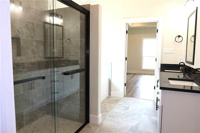 1977 Cambria Dr, Bryan, TX 77807 - bathroom with double vanity and a stall shower