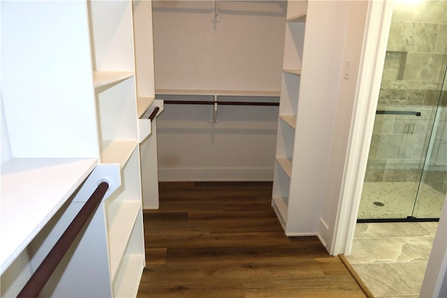 1977 Cambria Dr, Bryan, TX 77807 - walk in closet featuring dark wood-style floors