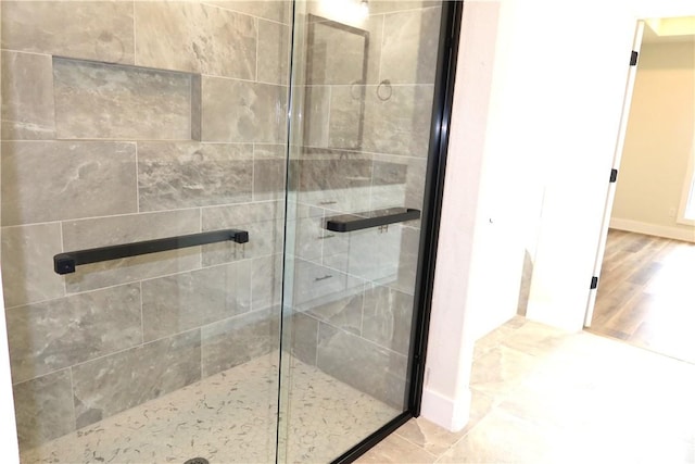 1977 Cambria Dr, Bryan, TX 77807 - bathroom featuring a shower stall and baseboards