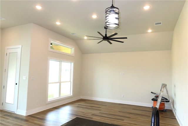 1977 Cambria Dr, Bryan, TX 77807 - empty room with wood finished floors, healthy amount of natural light, ceiling fan, recessed lighting, and vaulted ceiling